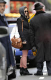 th_13879_Preppie_Olivia_Wilde_checking_out_of_her_hotel_in_London_17_122_490lo.jpg